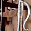 Custom volute on handrail before powder coating