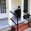 Railing shown here does not have  traditional standard volute  Railing custom built for traditional "farm style home" 